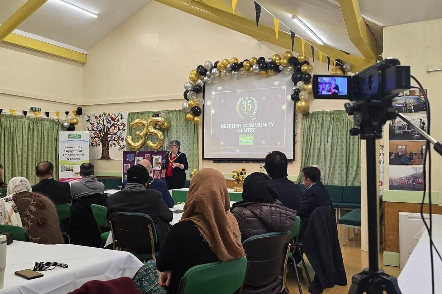 Speaker and audience at Deeplish Community Centre’s 35th anniversary event
