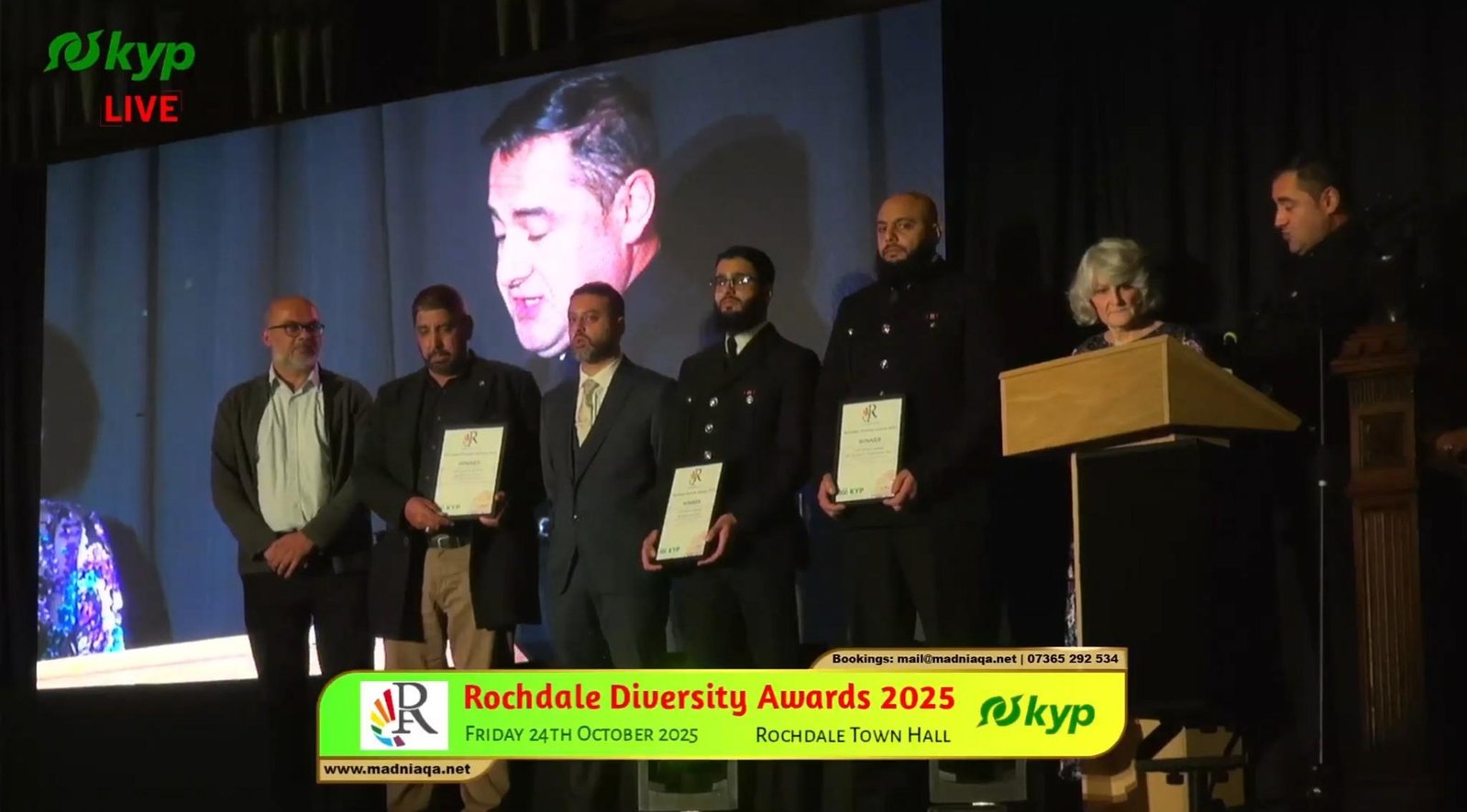 Award recipients on stage at the Rochdale Diversity Awards at Rochdale Town Hall